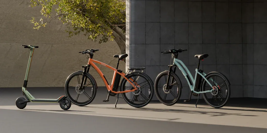 NINE09 electric scooter and two eBikes parked together as urban alternatives to the car