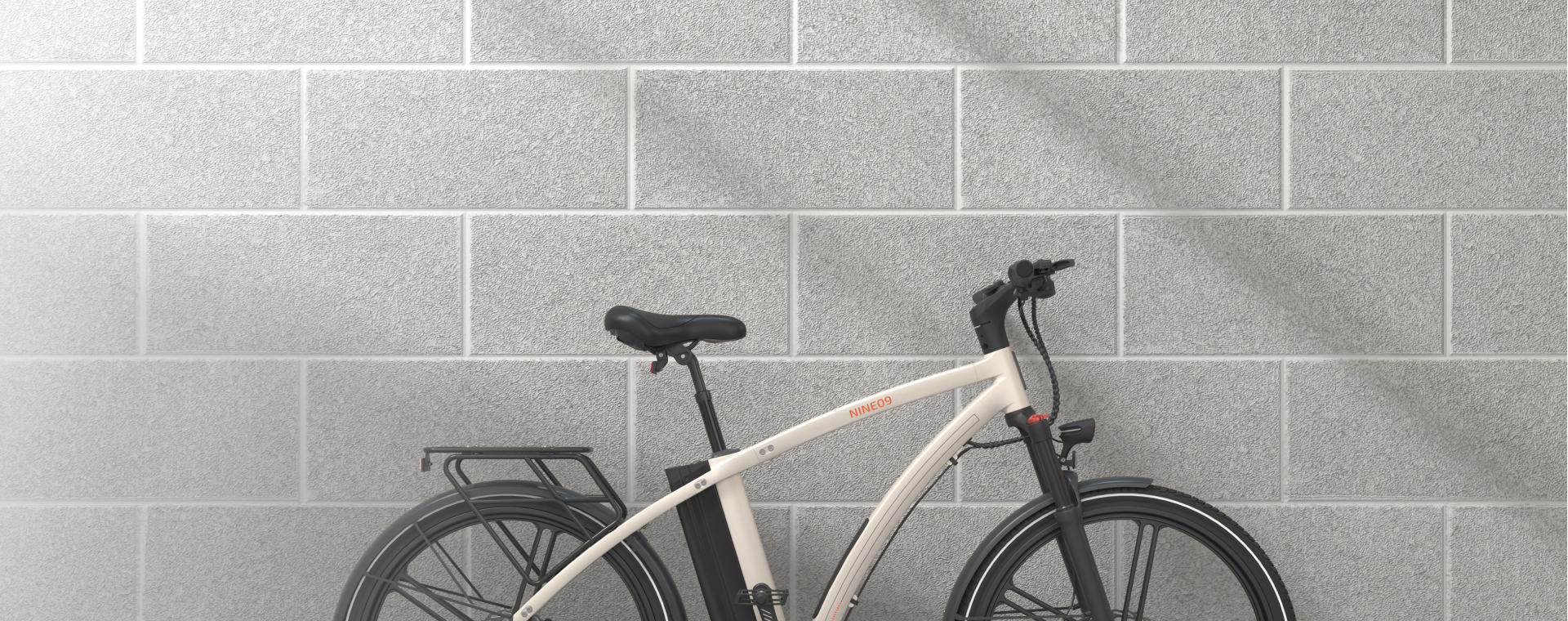 White NINE09 electric bike parked against a concrete block wall