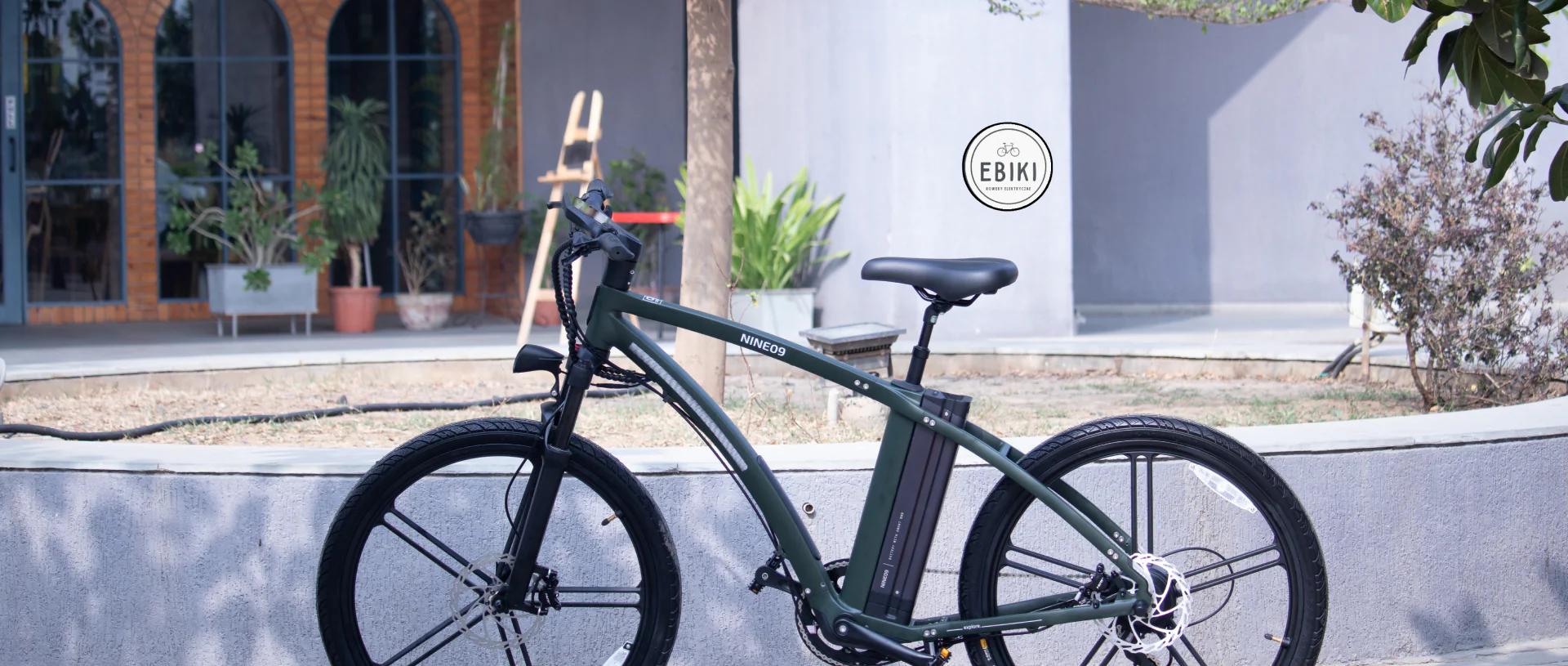 Green NINE09 electric bike parked outside the EBIKI eBike store in Poland