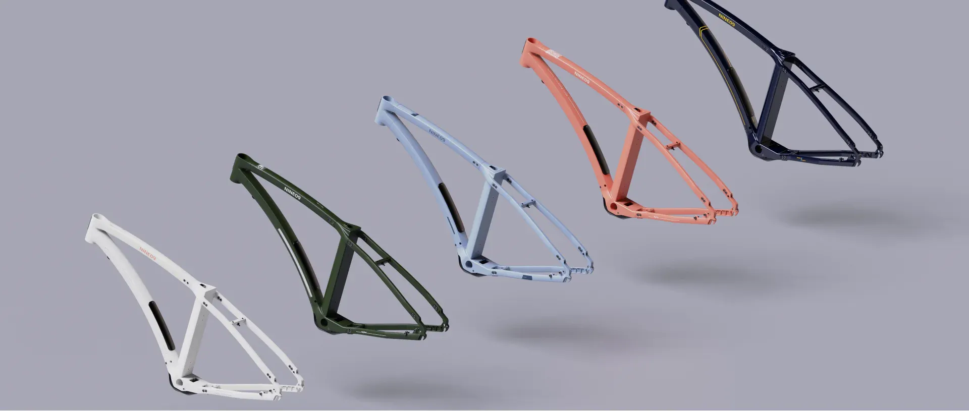 Five NINE09 eBike frames in white, olive green, sky blue, coral and navy colourways